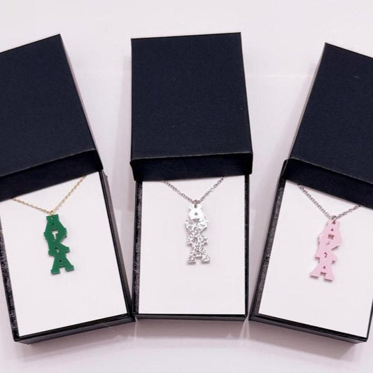 "Elegant AKA dainty charm necklace available in pink, green, and glitter, designed for the beautiful women of Alpha Kappa Alpha Sorority, Inc., to celebrate sisterhood and style."