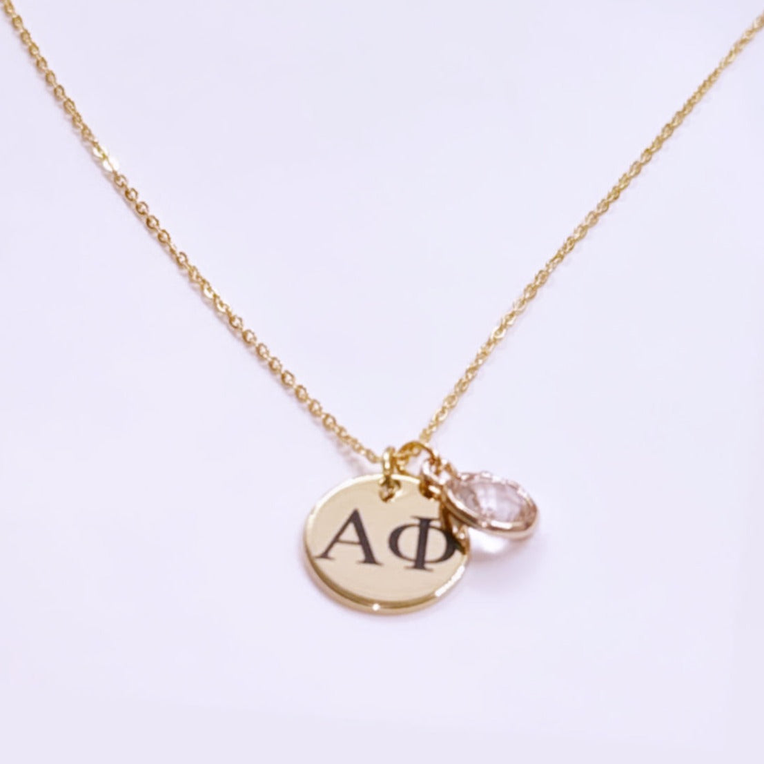 Gold plated charmed necklace.